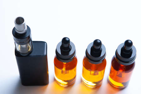 Vape pen. Element Vape. e vape. Smoking e-cigarettes. Vaping and liquids. Vaping mod e-cig. Smoking accessories. juice bottles for vaping. Equipment for la viper. The concept is the rejection of nicotine.の写真素材