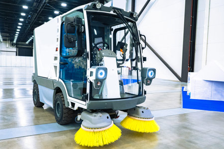 Floor cleaning machine. Special equipment for cleaning rooms. A machine is sweeping in a building....