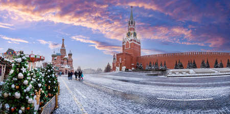 Moscow Christmas. Panorama Russia. Red Square on winter day. Christmas trees near Kremlin. St. Basil's Cathedral in snow. Winter Moscow with blue sky. New Year's tourism Moscow. Weekend in Russiaの写真素材
