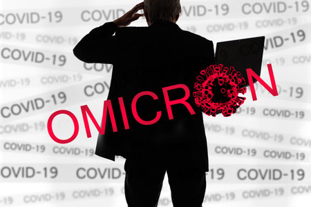 Omicron COVID-19 crisis. Mutated coronavirus SARS-CoV-2. Omicron infection logo. Man with laptop...