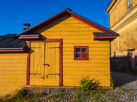Finland. Helsinki. House in the fortress of Suomenlinna. Fort Sveaborg. Sights of Finland. Territory of the fort. Historic buildings in Finland. Scandinavia. Finnish hut. Scandinavian architecture.の写真素材