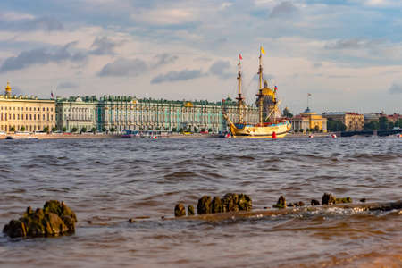 Russia. Saint Petersburg. Panorama of the Winter Palace. Canals of St. Petersburg. River Tours in St. Petersburg. Large sailboat at the promenade. The ship in the Neva. Guide to Russia. Tourism.の写真素材