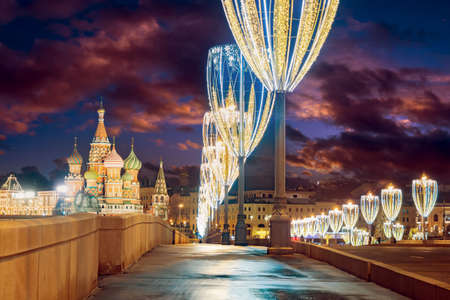 Moscow Christmas landscape. Russia is capital. New Year's embankment in Moscow. St. Basil's Cathedral. Winter night in Russia. Garlands on lanterns of Moscow. New Year's holidays to Russia.の写真素材
