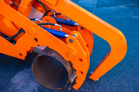 Equipment for laying pipes. Pipeline construction concept. Fragment of pipe during underground installation. Pipe laying machine. Replace old piping with modern equipment. Construction equipmentの写真素材