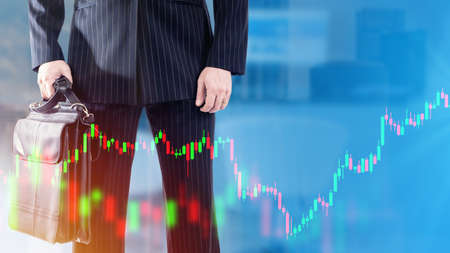 Businessman investment graph. Man in business suit without face. Investment quotes trading metaphor. Trader with briefcase in hand. Investor on blue background. Stocks currency trading .ART blurredの写真素材