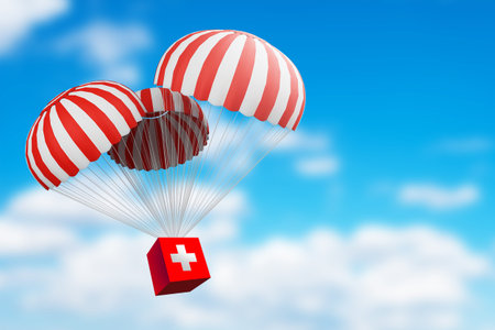 First aid kit falling with parachute. Concept - humanitarian aid. Medication delivery metaphor....