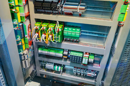 Electrical cabinet. Electrical equipment is divided into sectors. Structured electrical panel. Automation control panel. Cabinet with network equipment. Automation of production processes enterpriseの写真素材