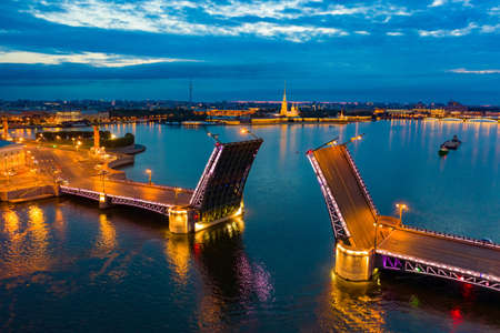 Saint Petersburg Russia. Palace bridge in white nights. The divorced bridge in Petersburg. The bridge across the Neva. Night St. Petersburg. Traveling in Russia. Cities of the Russian Federationの写真素材