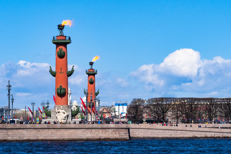 Saint Petersburg landmarks. Russia regions. Rostral columns in Saint Petersburg. Winter landscape of St. Petersburg. Sights of Russia. Rostral calones with fire on sky background. Russian Federationのeditorial素材