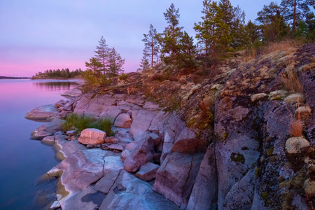 Karelia. Russia. Lake Ladoga in Corelia. Picturesque landscapes of Ladoga. Northern nature. The nature of Karelia. Cliff by the lake. Ladoga skerries. The rocky coast. Tourism in Russia.の写真素材