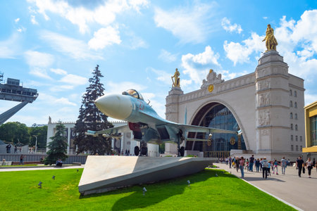 Moscow. Russia. Tourists in the park Exhibition of Achievements of National Economy. Military exhibition in the park VDNKh. Military fighter exhibited in the park. People walk in the park. 07.21.2019のeditorial素材