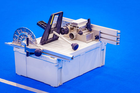 Milling machine on a blue background. Equipment for cutting metal profiles. Milling machine for...