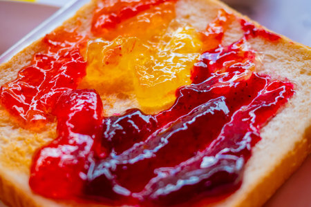 Japanese food. Jam on bread toast. Multi-colored jam is spread on toasted bread. Japanese breakfast....