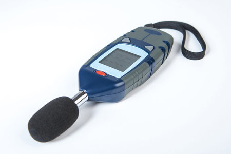 Sound level meter off. Sound level meter lies on a white background. Apparatus for measuring noise...