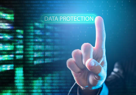 Data protection logo on virtual screen. Secure data storage technologies. Man's hand reaches for inscription Data protection. database security. Safe storage software. database management.の写真素材