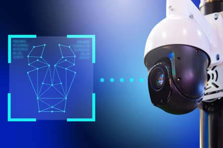 Recognize this person. CCTV camera on blue background. Video surveillance with function in it to Recognize face. Indication of their privacy identity concert ID Face technology. CCTV Security Cameraの写真素材