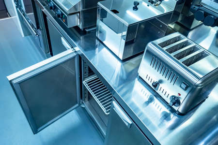 equipment for restaurants. Kitchen is on the food front. Toaster. Deep-fried Steel kitchen cabinet. Open cupboard in the restaurant kitchen. Equipment for horeca. Catering Enterprise. Cateringの写真素材