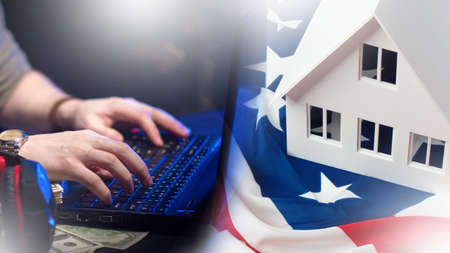A man swings on the keyboard. USA flag near the house. Layout of the house. Filling out a green card application. Human plays green card latorea. Immigration to the United States of America.の写真素材