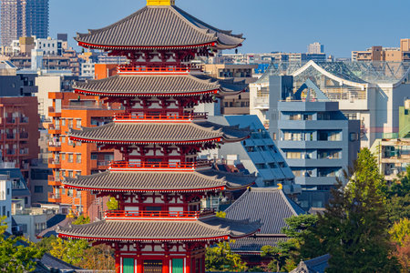 Tokyo. Japan. Asakusa temple on the background of buildings. Sensoji Temple Tower. Three Deities. Guide to Asakusa Street. Sights of Tokyo. Japanese architecture. Japanese traditional. Summer.のeditorial素材
