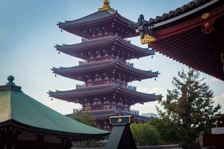 Japan. Tokyo. Asakusa Pagoda. Temples of Asakusa district. Buddhist pagoda in Tokyo. Sensoji Temple in Japan. Temple of the Three Deities. Vacation in Tokyo. Japan vintage. Exterior buddhist churchesのeditorial素材