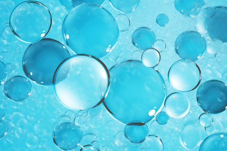 Water bubbles. Background with liquid and air bubbles. Blue texture with soapy waterの素材