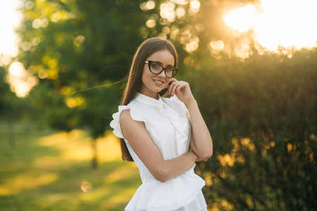 Business lady uses a tablet in the park during a breakの写真素材