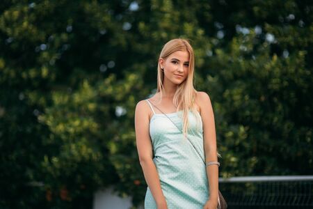 Model walk around the city and use posing. Sunny day. Summer.の写真素材