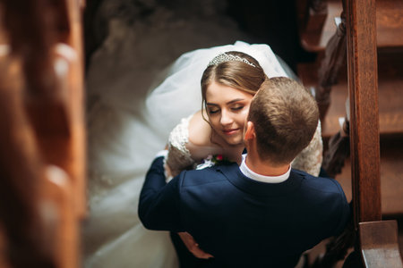 Beautiful couple walking in the park in their wedding dayの写真素材