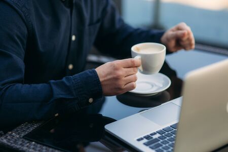 The young manager working on a laptop in the park. Lunch Break.の写真素材