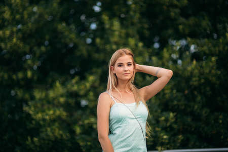 Brunette and blonde are photographed and enjoy life. Sunny day. Summer.の写真素材