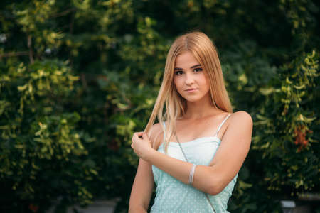 Brunette and blonde are photographed and enjoy life. Sunny day. Summer.の写真素材