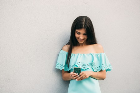 Models walk around the city and use Gadgets. Sunny day. Summer.の写真素材