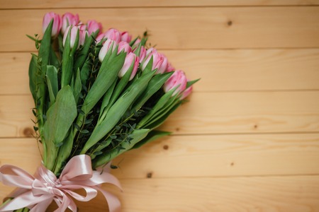 Pink tulips on a wooden backgroundの写真素材
