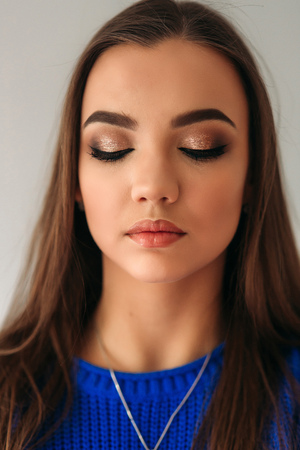 Model closed her eyes to show her makeupの写真素材