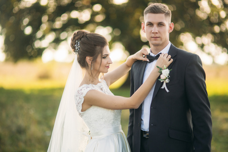 Funny couple in background of big treeの写真素材