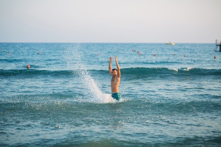 Man splash sea waterの写真素材