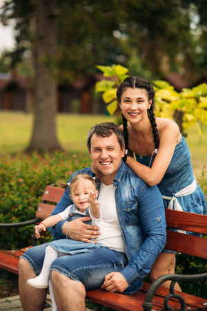 happy young family spending time outdoor on a summer dayの写真素材