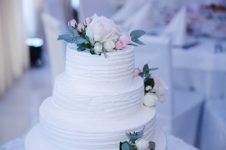 Beautiful wedding cake decorated with flowers. summerの写真素材