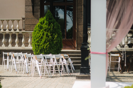 White chair with white umbrella. Wedding ceremony.の写真素材
