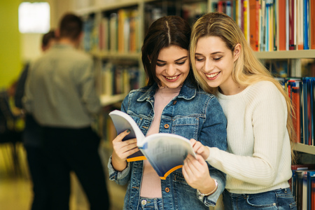 Group of student want to find some helpful literature to preparing for university examの写真素材