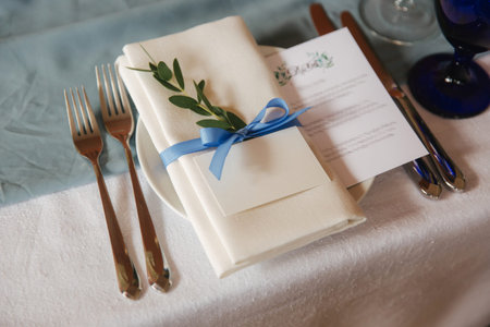 Table appointsment in restaurant. Wedding decoration in blue style