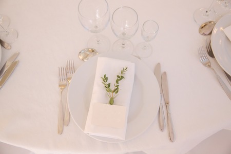 table appointments in restaurant. wedding decoration with floral elementsの写真素材