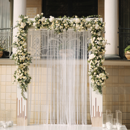 Arch decorated with flowers at the wedding caremonyの写真素材