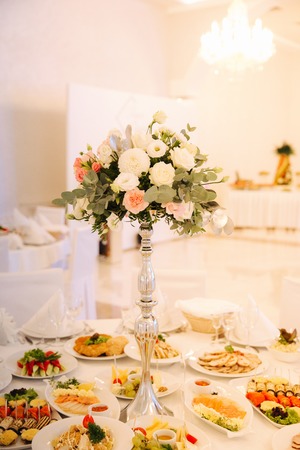 Wedding bouquet in restaurant on the tableの写真素材