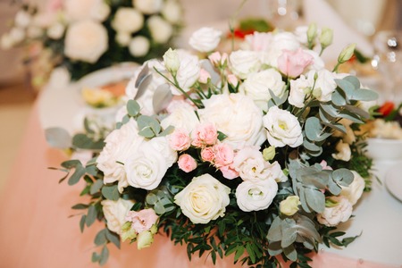 Wedding bouquet in restaurant on the tableの写真素材