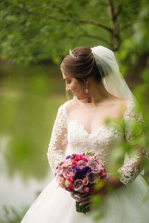 Beautiful bride in pakr on the wedding dayの写真素材