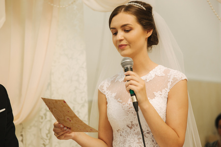 Groom and bride at the wedding ceremony in the churchの写真素材