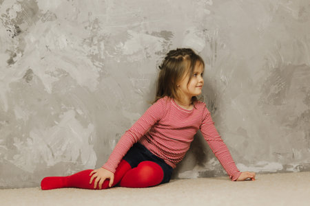Beautiful little girl having fun at home. Five year old girl play at home
