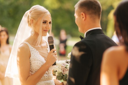 Wedding couple on ceremony outside. beautiful bride and handsome groom. Just marriedの写真素材
