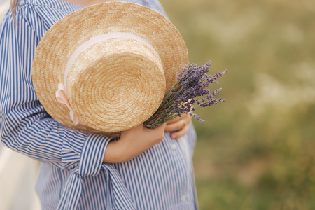 Mid selection of woman hold in hand hat and lavenderの写真素材